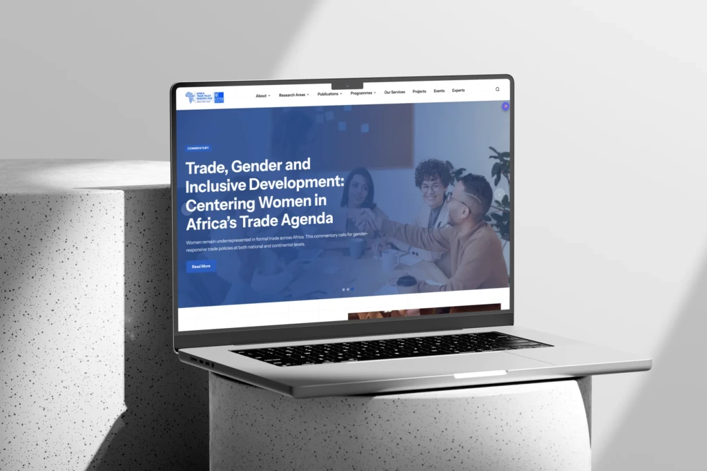 Trade policy research website homepage on a laptop screen